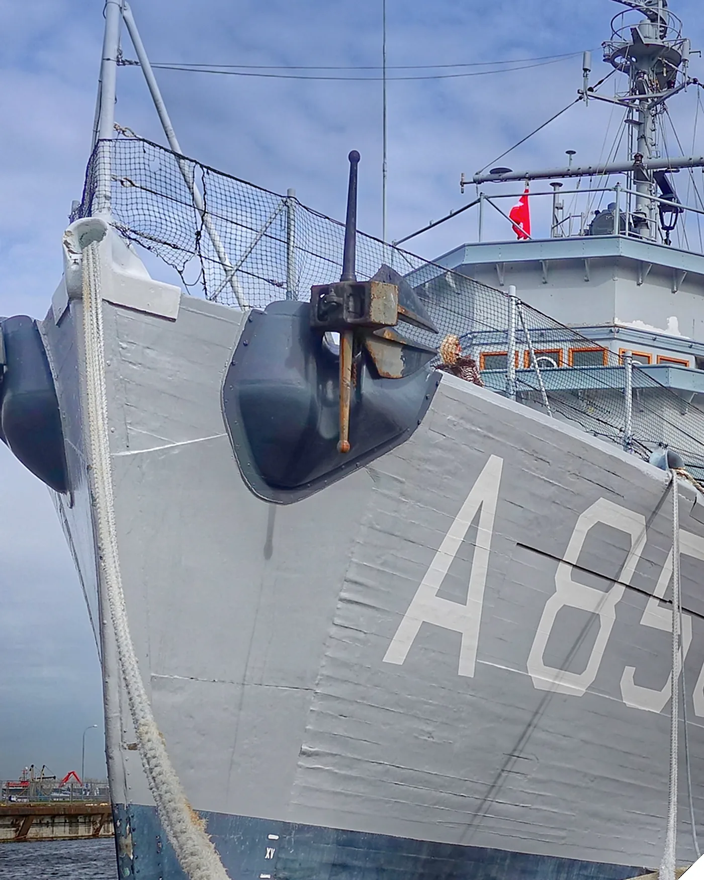 Vessel alongside a berth with mooring lines and fenders in place