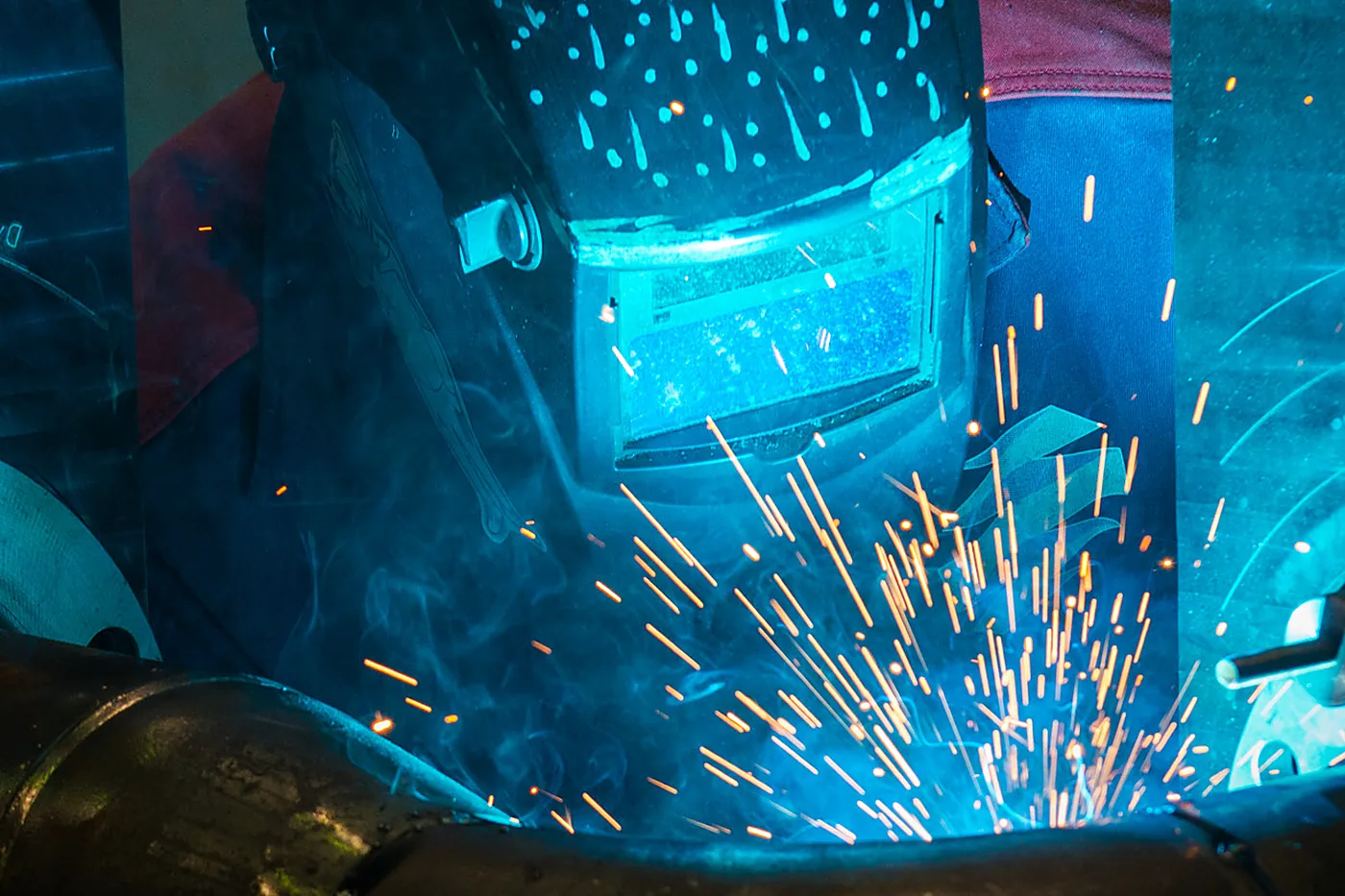 Marine technician carrying out hot work on a large diameter pipe