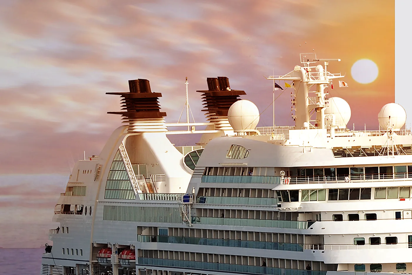 Passenger vessel under way at sea at dusk